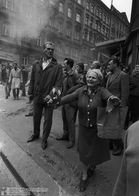 The "Prague Spring" Comes to an End when Warsaw Pact Troops Invade the Czechoslovak Socialist Republic – Woman with a Photograph of Alexander Dubcek und Ludvík Svoboda (August 21, 1968) 